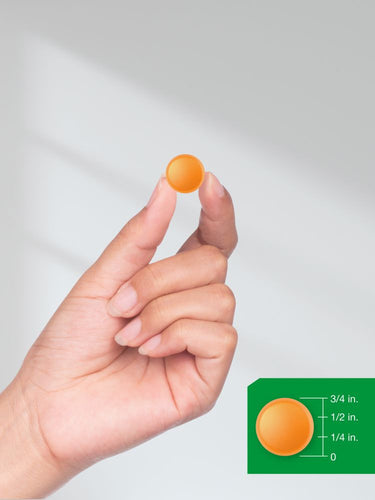 View 8 Hand holding an orange object with a size reference on a gray background