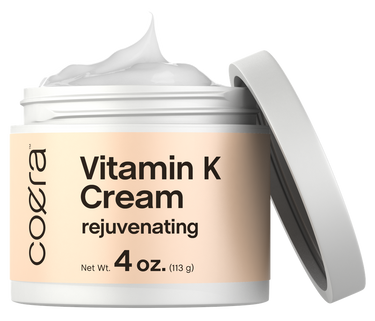 Coera Vitamin K Cream jar with cream visible on a white background
