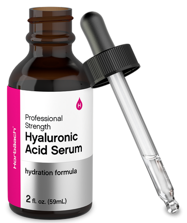 View 1 Hyaluronic acid serum bottle with dropper on a white background