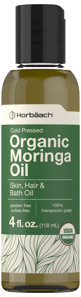 Bottle of Harbäach Organic Moringa Oil with green label and black cap.