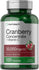 Bottle of Horbaach Cranberry Concentrate + Vitamin C supplement with green and silver design.