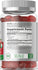 Supplement bottle with gummy vitamins and label showing supplement facts.