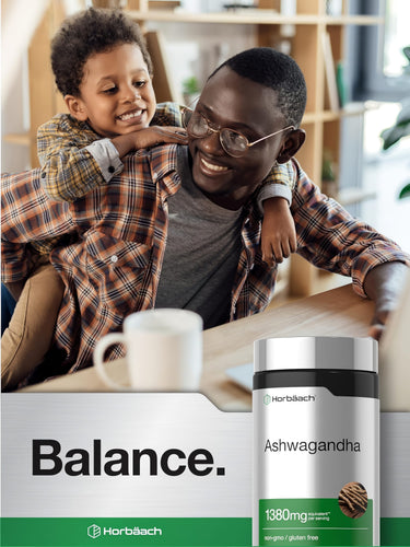 View 6 African American man and child smiling beside a Horbäach Ashwagandha bottle, with the child leaning on the man's shoulder.
