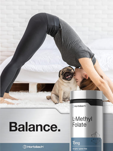 View 6 A young woman in a yoga pose smiles as a pug licks her face, beside an L-Methyl Folate bottle.