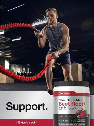 View 6 A man exercises with battle ropes in a gym, next to a jar of Horbäach Beet Root+.