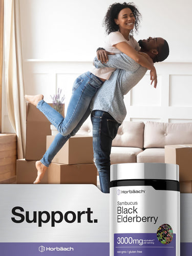 View 6 Young African American couple joyfully embracing in their new home beside a Horbaach Black Elderberry bottle.