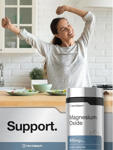 View 6 Young adult woman happily stretching in a kitchen beside a bottle of Horbaach Magnesium supplement.