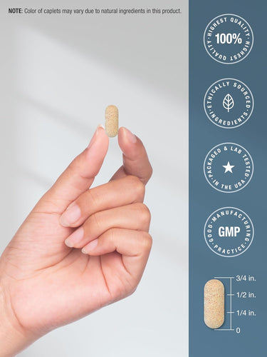 Hand holding a caplet with product quality and manufacturing details on a blue background