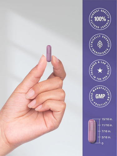View 7 A hand holds a single purple capsule measuring 15/16 inches long.