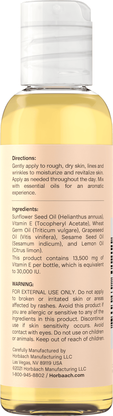 View 6 Back label of Vitamin E Oil bottle showing Directions, Ingredients, Warning, and manufacturer information.