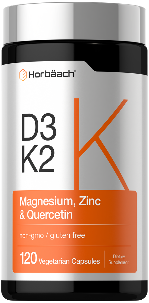 A bottle of 120 vegetarian capsules containing D3, K2, magnesium, zinc, and quercetin on a hand scale.