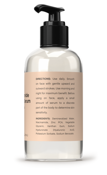 Clear bottle with black pump and beige label on a white background