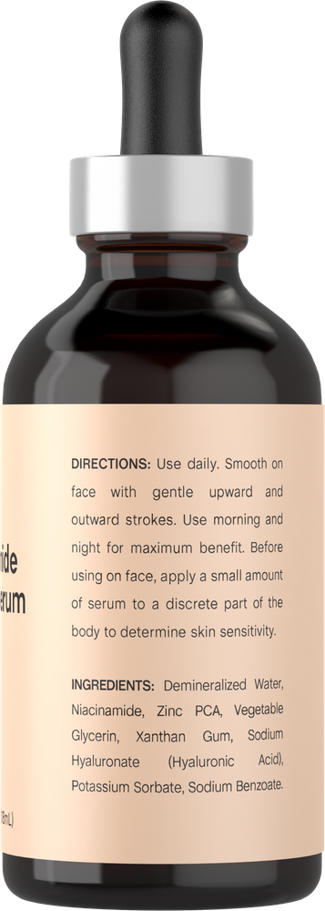 Skincare serum bottle with dropper and label on a white background