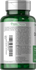 Green dietary supplement bottle with label