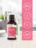 Honeysuckle essential oil bottle with pink label on a white surface, featuring Harborside Essentials branding.