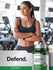 Woman in a gym setting with a bottle of Horbaach Odorless Garlic supplement.