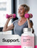 Woman exercising with pink dumbbells next to a bottle of Horbaach Women's Multi supplement.